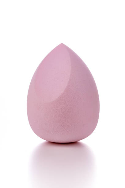 Makeup sponge a fuchsia shade isolated on white background