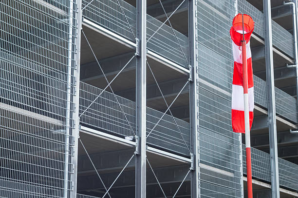 istock Windsock showing wind direction near modern building 2210037552