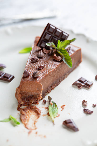 Single slice of vegan chocolate mousse cake with toppings