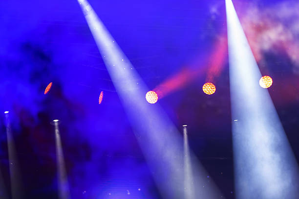 istock Stage white beams of light on dark blue background. Stage lighting for a concert. 2210039632