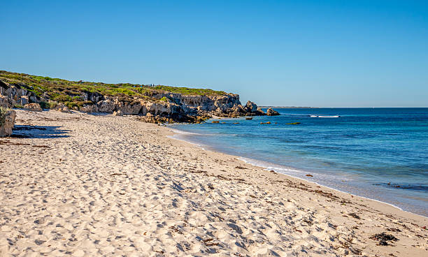 istock Scenic Coastal Beach with Rolling Waves and Rocky Cliffs Under a Clear Sky at Burns Beach, Perth, Australia, March 2020 2210041285