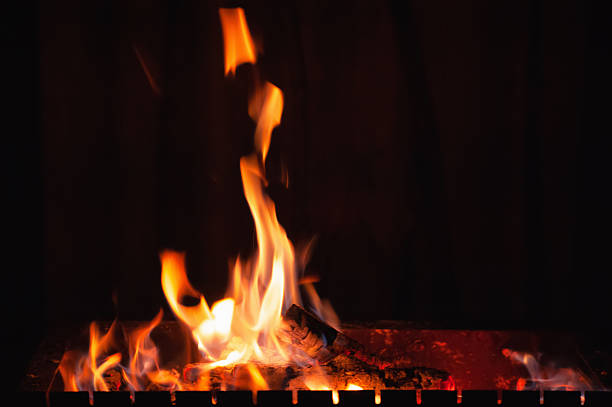 Bright burning wood in a camping on a black background