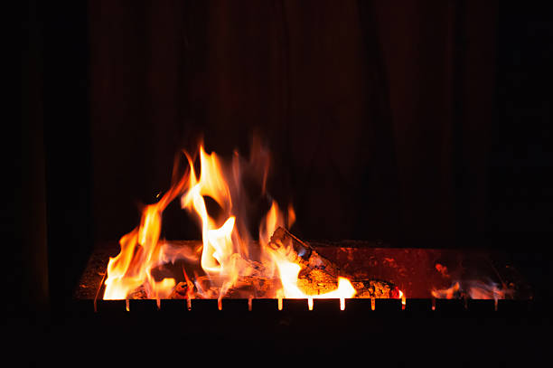 Bright burning wood in a camping on a black background