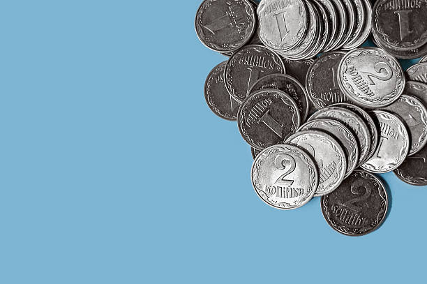 istock Cash coins, money concept, on blue background 2210048322