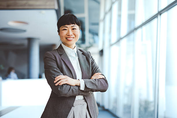 istock Asian corporate employee portrait in office environment 2210049445