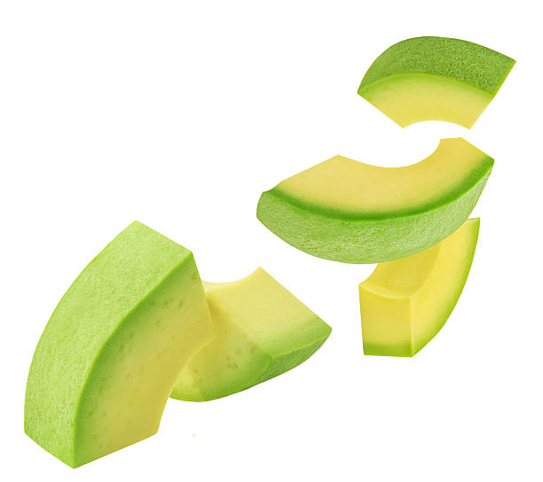 istock Falling Avocado pieces isolated on white. Levitating Avocado fruit slices. Avocado Explosion. Top view. Flat lay. Package design element.  Creative layout 2210052550