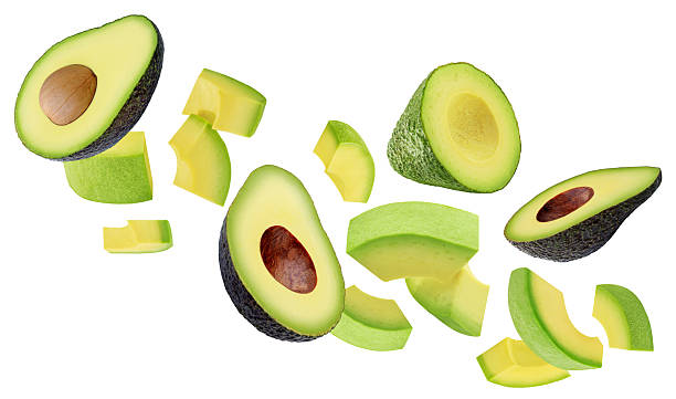 istock Levitating Avocado pieces isolated on white. Flying Avocado fruit slices. Avocado Explosion. Top view. Flat lay. Package design element 2210052608