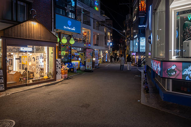 Seoul, South Korea - Jun 28, 2024: A lively night scene featuring illuminated storefronts in a commercial district. The bright lights and various businesses contribute to the unique cityscape.