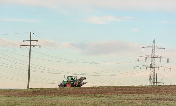 istock Tractor working the agricultural fields outside of Stuttgart city, Germany 2210057437