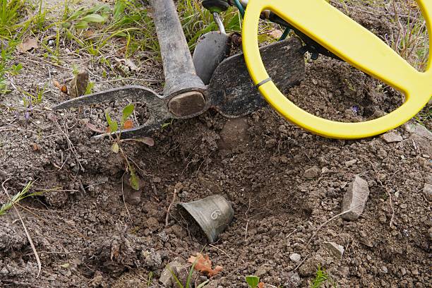 istock Treasure hunting with a metal detector. 2210059007