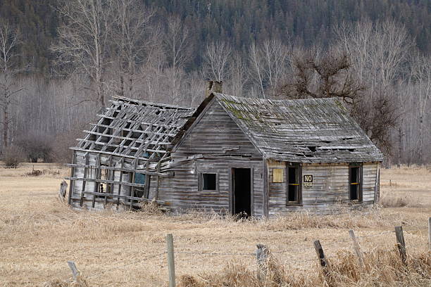 istock Old abandoned farmhouse in a mountain country setting. 2210067943