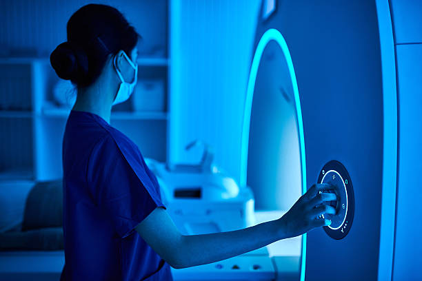 istock Female Nurse Operating MRI Scan Machine at MRI-scanner Room 2210069438