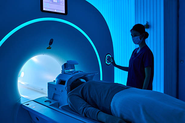 istock Female Nurse Operating MRI Scan Machine at MRI-scanner Room 2210069674