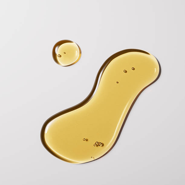 istock Oil texture drops, cosmetic product yellow stain swatch 3d rendering 2210070799