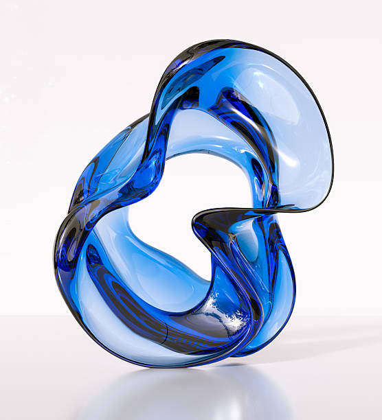 istock A modern and abstract sculpture from translucent blue glass. Flowing, twisting form creates an intriguing play of light and shadow, accentuating the smoothness of the material. The image conveys sophistication, artistry, and contemporary 3d rendering desi 2210070838