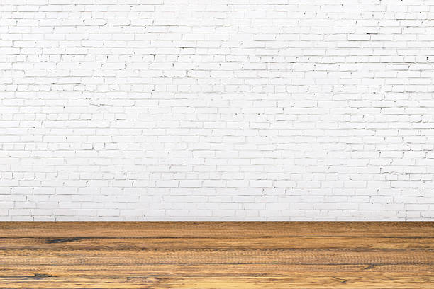 istock wood floor and white brick wall as background, light room interior 2210072242