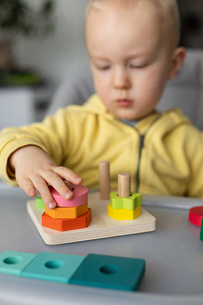 istock Baby is busy with educational toy, Closeup, selective focus. 2210074201