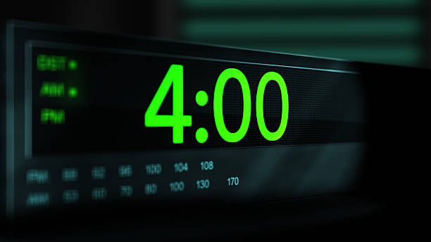 istock Camera pans across old digital clock as time arrives at 4 AM - Green Version 2210074948