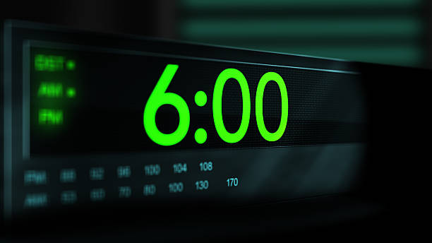 istock Camera pans across old digital clock as time arrives at 6 AM - Green Version 2210075165