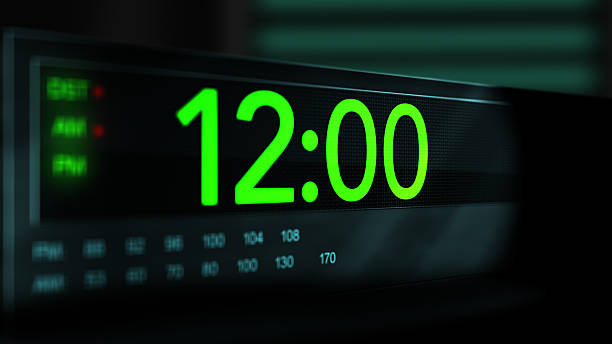 istock Camera pans across old digital clock as time arrives at 12 AM - Green Version 2210075168