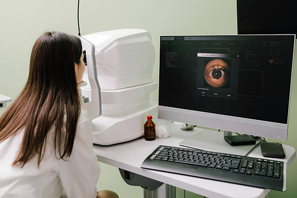 OCT eye scan imaging at an ophthalmology clinic. Girl undergoes a retina exam using optical coherence tomograph. Detailed eye image for diagnosing glaucoma, macular degeneration, and vision issues.