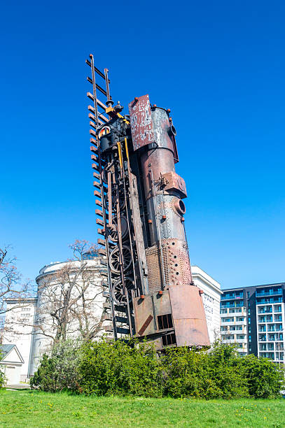 Wroclaw, Poland - April 5, 2025: The Train to heaven monument by Andrzej Jarodzki with train PKP class Ty2.