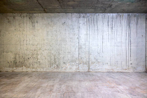 istock Empty Concrete Storage Room with Industrial Lighting 2210076918