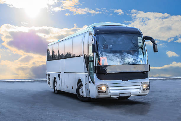Tourist bus against beautiful cloudy sky