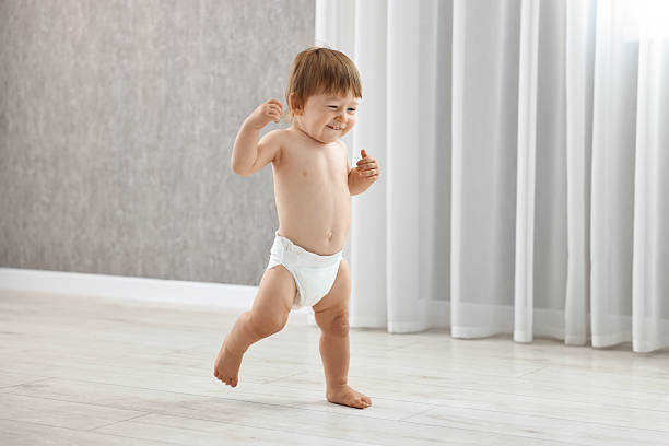 istock Cute little child in diaper at home 2210080349