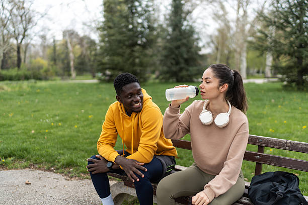 istock Young couple resting during training in the park 2210082585
