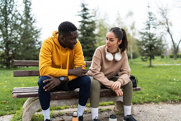 istock Young couple resting during training in the park 2210082619