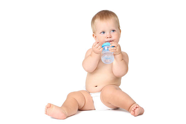 istock Baby boy drinking water from bottle isolated on white background 2210082814