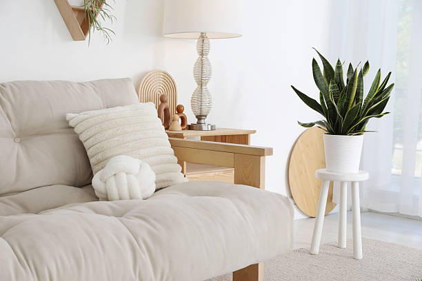 istock Stool, sofa, lamp and houseplant at home. Interior design 2210083766