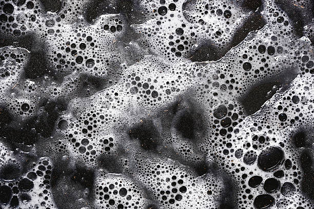 istock White foam bubbles texture. Soap water background. Clean foam abstract. Fresh soapy surface. Washing bubble layer. 2210084654