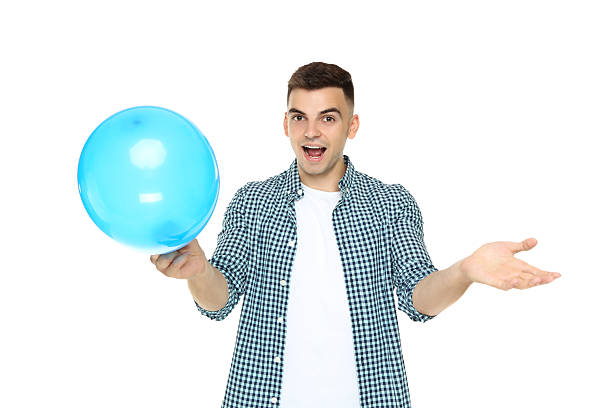 istock Yuong man with balloon isolated on white background 2210085333