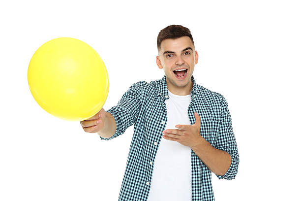 istock Yuong man with balloon isolated on white background 2210085730