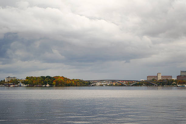 Stockholm suburbs on the other side of a waterfront on a cloudy autumn day, Sweden