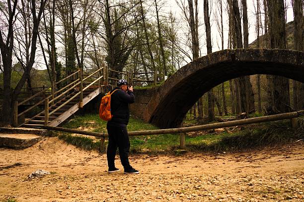 A person taking a photo in nature