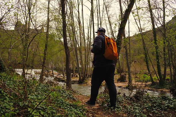 istock A person walking along the river 2210087186