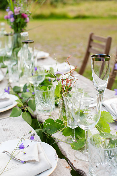 istock Close-Up of Rustic Summer Table Setting with Wildflowers 2210088279