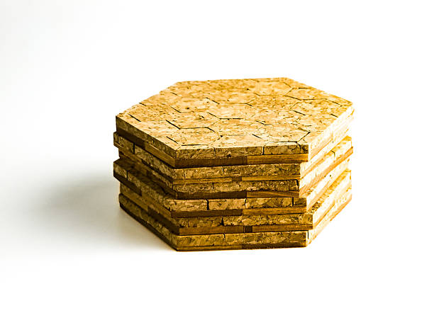 istock Stack of cork hot pads in hexagon shape isolated on white background 2210090108