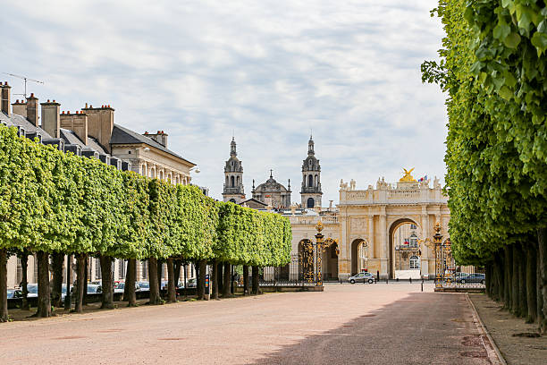 istock A large, empty courtyard with a row of trees on either side in Nancy France 2210090268