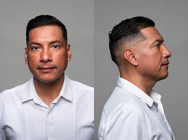 Hispanic man front and profile mugshots stock photo