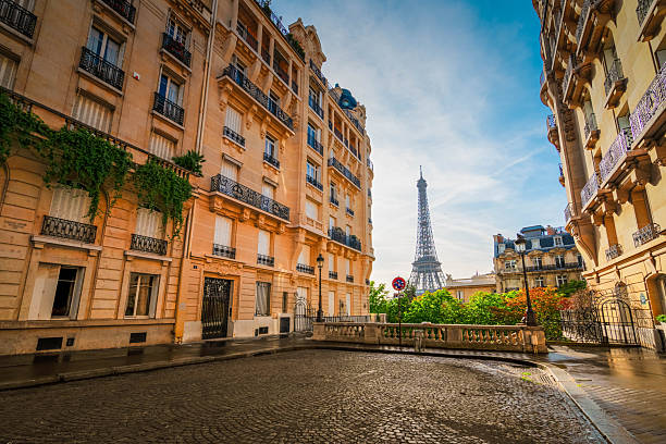 istock eiffel tour and Paris street 2210098973