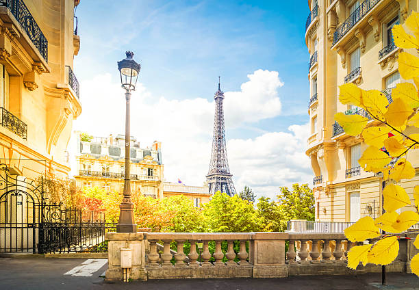 istock eiffel tour and Paris street 2210099243