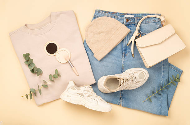 istock Flat lay with women's trendy spring outfit on beige background, top view 2210109777
