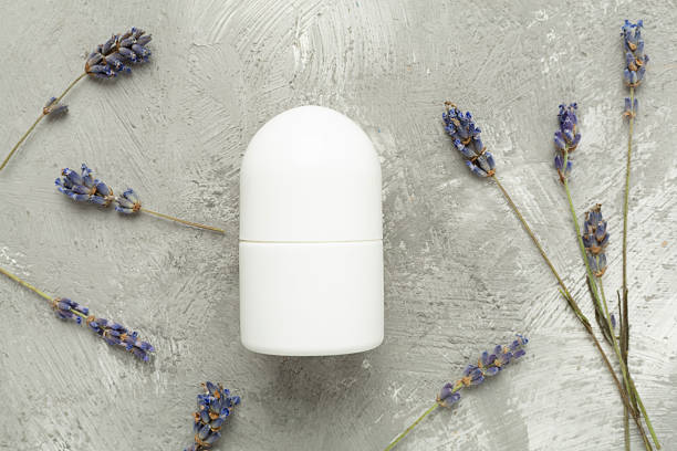 istock Lavender deodorant on concrete background,, top view 2210110273