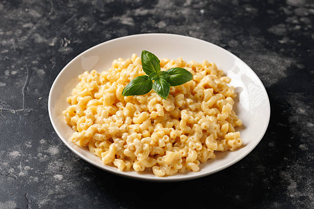 istock Creamy mac and cheese macaroni in a white bowl 2210112810