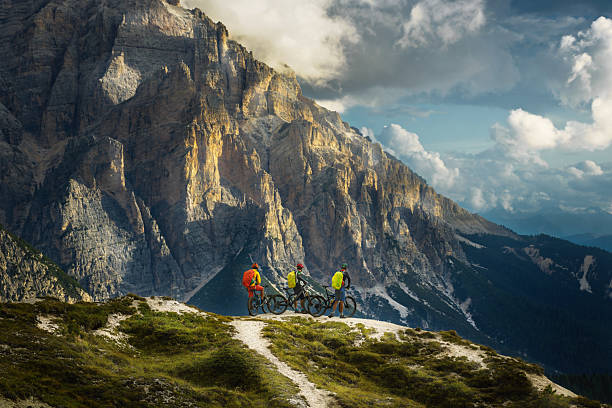 istock Friends exploring mountains together by bicycles 2210114053