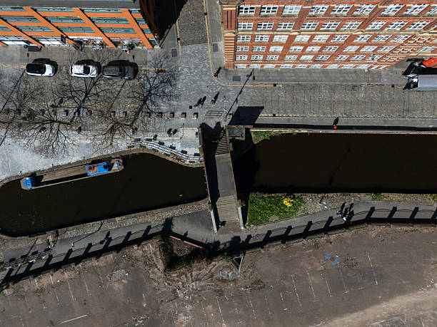 An aerial photograph of the Rochdale Canal and several Victorian Mills in Ancoats in downtown Manchester, Northwest England. The photograph looks directly down upon the mills in this photograph which are located on Redhill Street, adjacent to the Rochdale Canal.